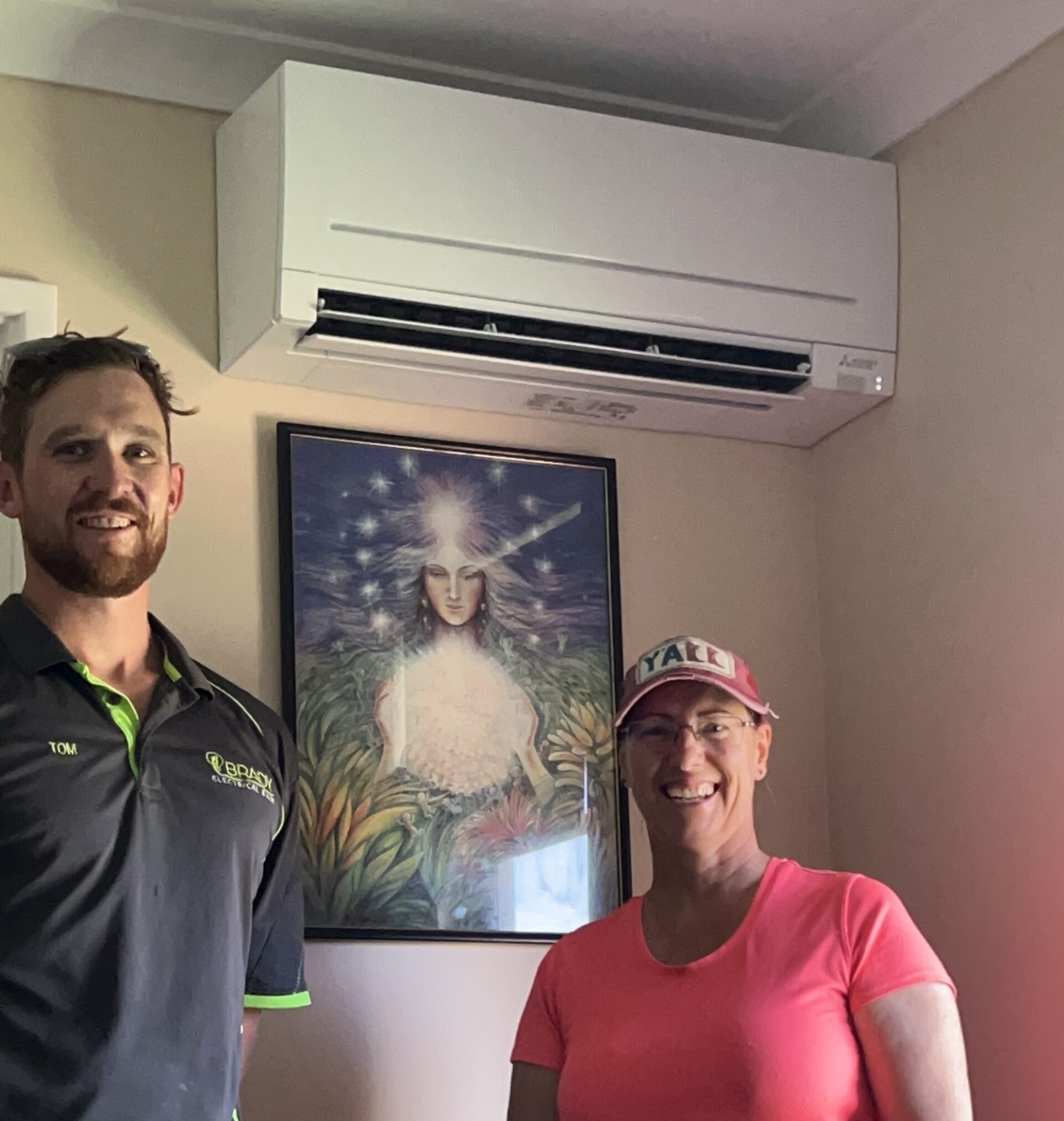 Tom and client under air con just installed