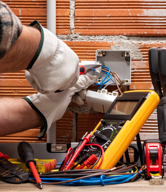 electrician working on wall